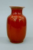 A Chinese sang de boeuf red glazed vase, with six character mark to base. 18 cm high.