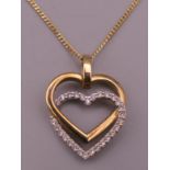 A 9 ct gold and cubic zirconia heart shaped pendant on chain.