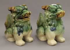 A pair of porcelain dogs-of-fo. 24.5 cm high.