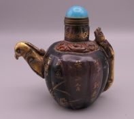 A Chinese hardstone snuff bottle decorated with calligraphy. 7 cm high.