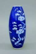 A 19th century Chinese vase with prunus blossom decoration. 24 cm high.