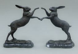 A pair of bronze boxing hares. 29 cm high.