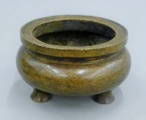 A Chinese bronze censer. 14 cm diameter.