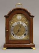A mahogany mantle clock. 26 cm high.