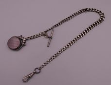 A silver Albert chain set with swivel spinning fob. 31 cm long. 36 grammes total weight.