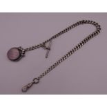A silver Albert chain set with swivel spinning fob. 31 cm long. 36 grammes total weight.