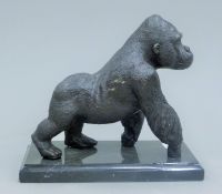 A bronze model of a gorilla. 18 cm high.