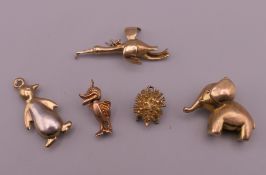 Five 9 ct gold animal charms, including an elephant, penguin and a hedgehog. The largest 3 cm long.