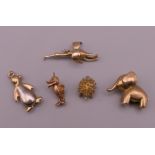 Five 9 ct gold animal charms, including an elephant, penguin and a hedgehog. The largest 3 cm long.