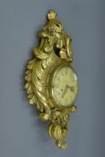 A giltwood Cartel clock. 57 cm high.