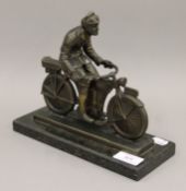 An early 20th century bronzed model of a motorcyclist, signed SCHMIDT HOFER,