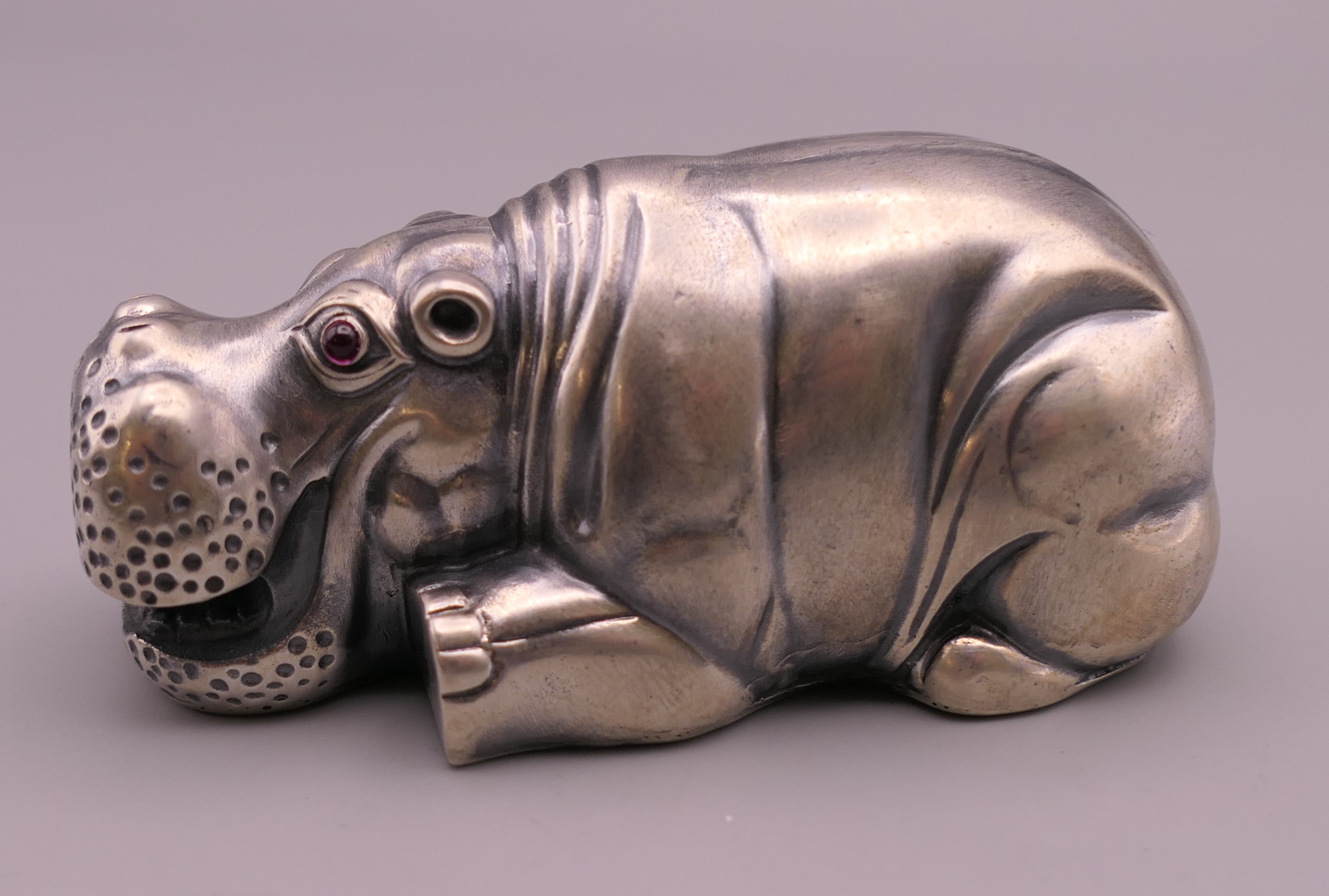 A silver model of a hippo, bearing Russian marks. 7.5 cm long.