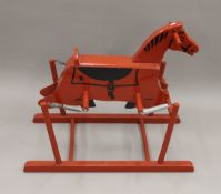 A rocking horse. 80 cm long.