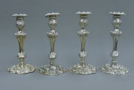 A set of four Georgian silver candlesticks. 26 cm high. 3118.