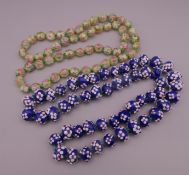 Two Italian glass beaded necklaces. The blue example 74 cm long, the other 70 cm long.