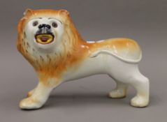 A Sadler pottery lion. 32.5 cm long.