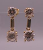 A pair of 14 ct gold cubic zirconia drop earrings. 2 cm high. 3.3 grammes total weight.