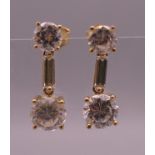 A pair of 14 ct gold cubic zirconia drop earrings. 2 cm high. 3.3 grammes total weight.