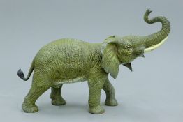 A cold painted bronze model of an elephant. 22 cm high.