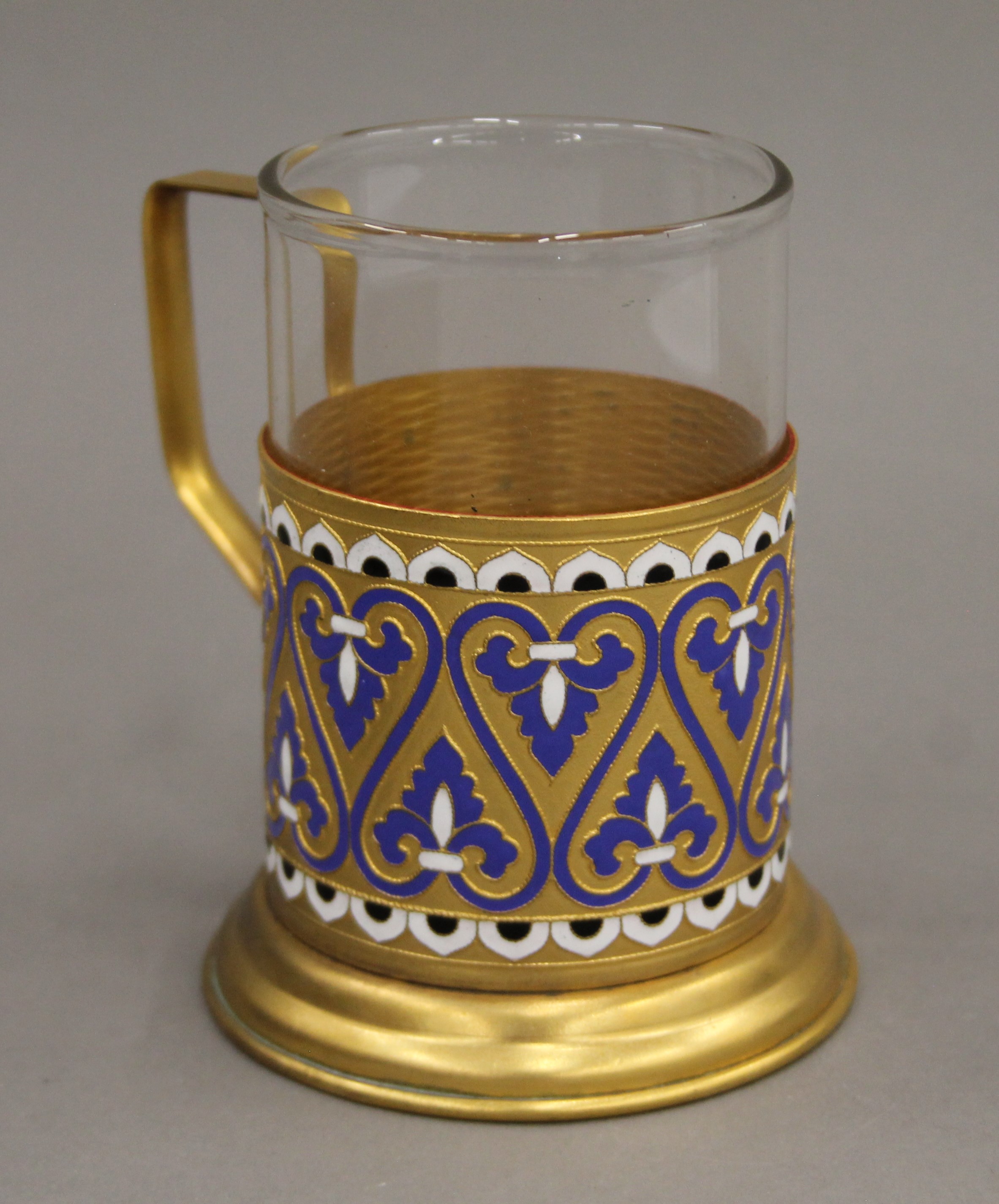 An enamel decorated Russian beaker, boxed. The beaker 11 cm high overall.