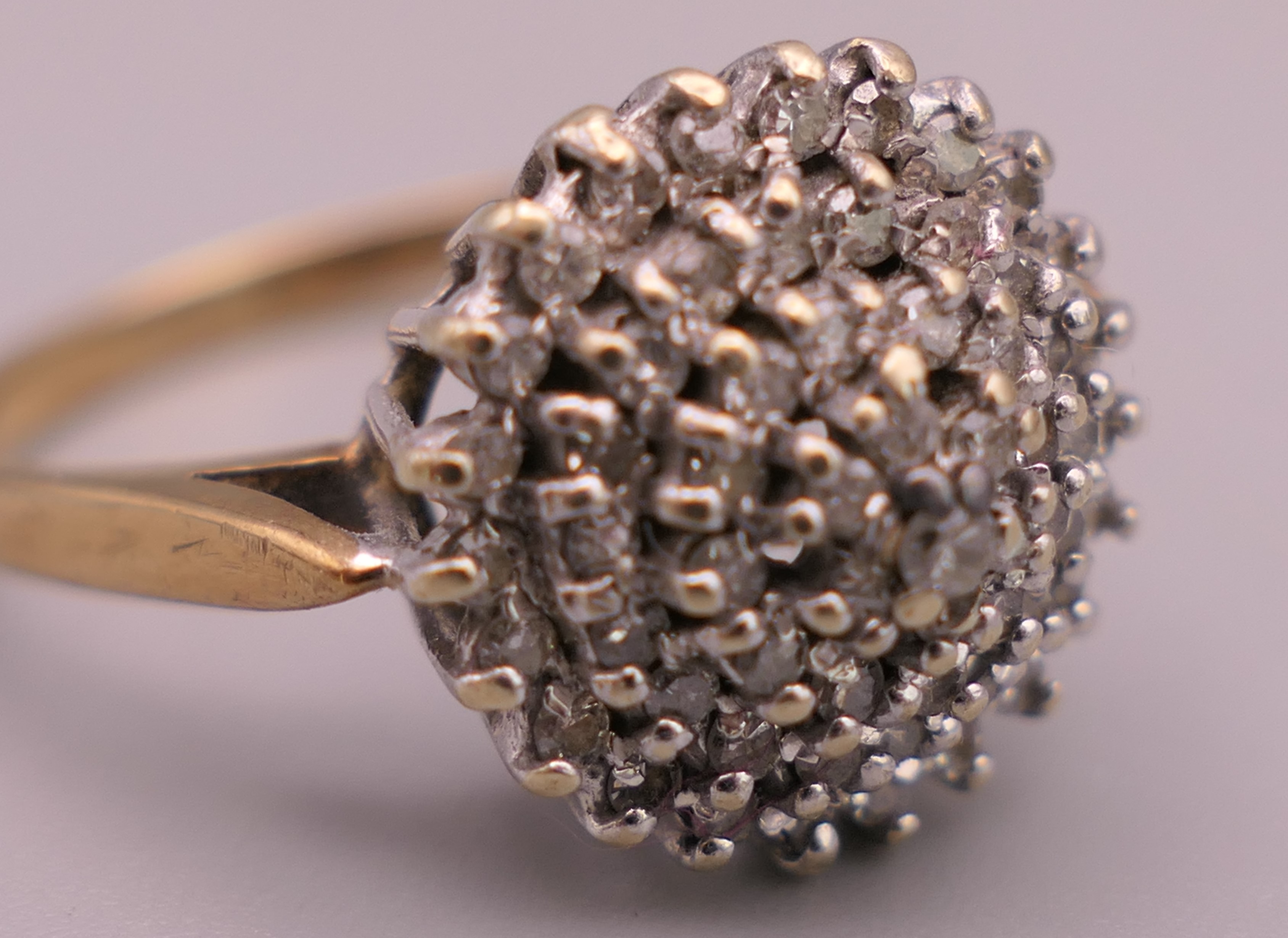 A 9 ct gold 0.5 carat diamond cluster ring. Ring size S/T. 4 grammes total weight. - Image 4 of 6