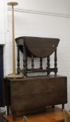 Two oak drop leaf tables and a plant stand.