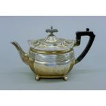 A silver teapot. 28 cm long. 531.7 grammes total weight.