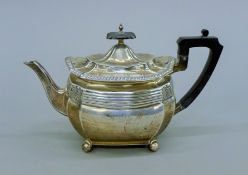 A silver teapot. 28 cm long. 531.7 grammes total weight.