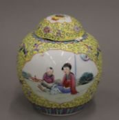 A Chinese yellow ground porcelain ginger jar painted with figures. 14 cm high.