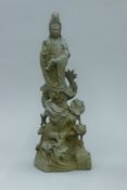 A bronze model of Guanyin and a dragon. 35.5 cm high.