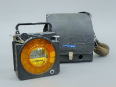 A junior pigeon racing clock with thimbles.