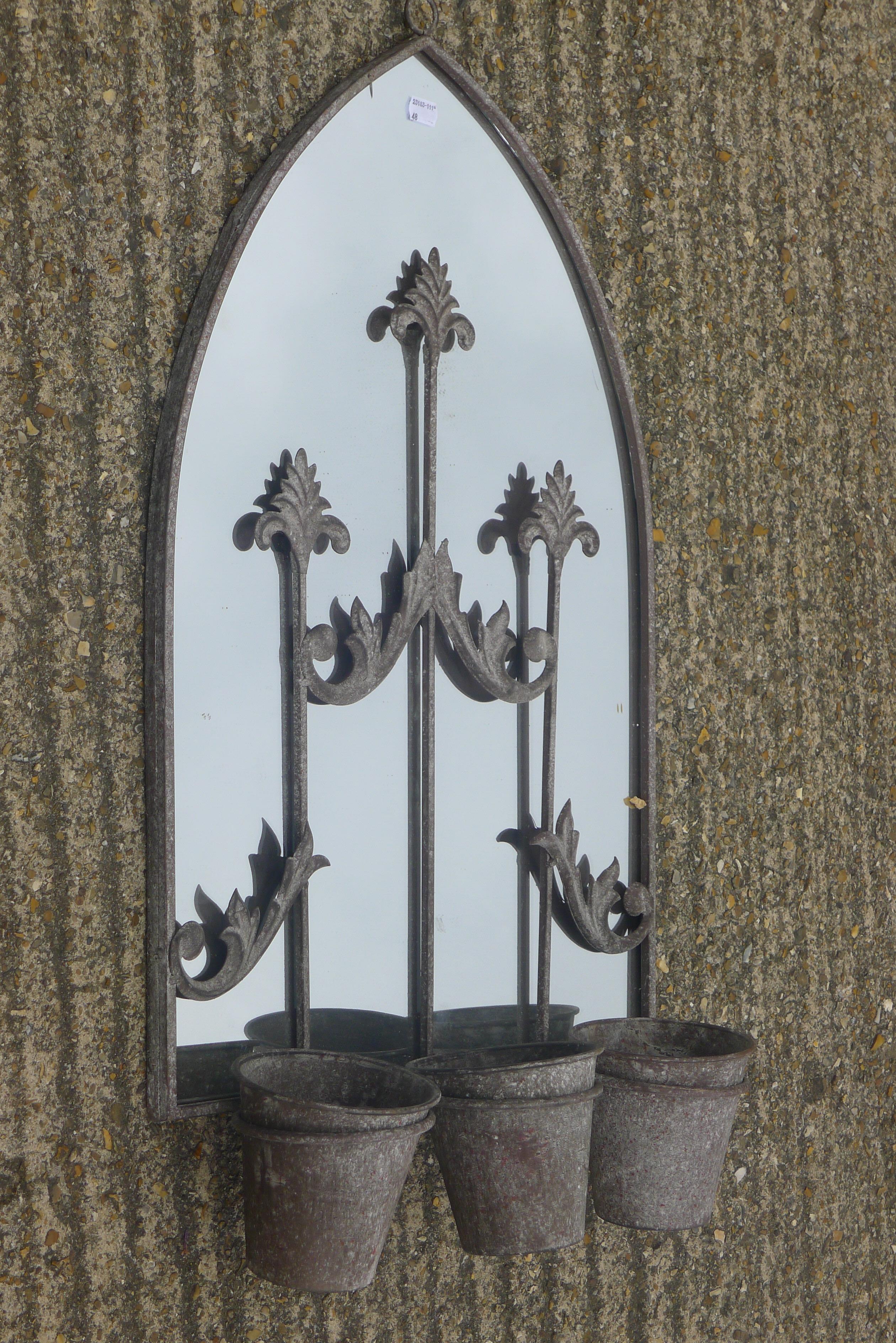 Two iron pot mirrors. The largest 72 cm high.