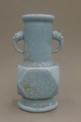 A Chinese light blue porcelain fo dog handle vase. 29 cm high.