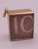 A 9 ct gold emergency ten shilling note charm. 1.5 cm long. 2.6 grammes total weight.