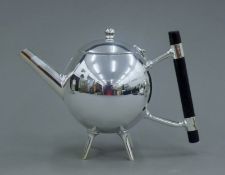 A Christopher Dresser style silver plated teapot. 14 cm high.