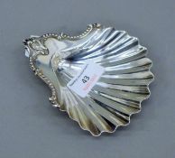 A Georgian silver butter shell. 11 cm wide. 86.8 grammes.