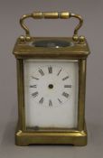 A brass cased carriage clock. 13 cm high.