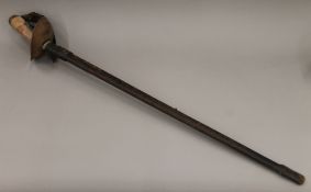 A Cavalry sword in a leather scabbard. 111 cm long.
