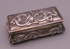 A Chinese silver box, makers mark Wang Hing. 9.5 cm x 5 cm. 123.3 grammes.