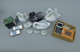 A quantity of miscellaneous items, including porcelain swans, magic lantern slides, etc.
