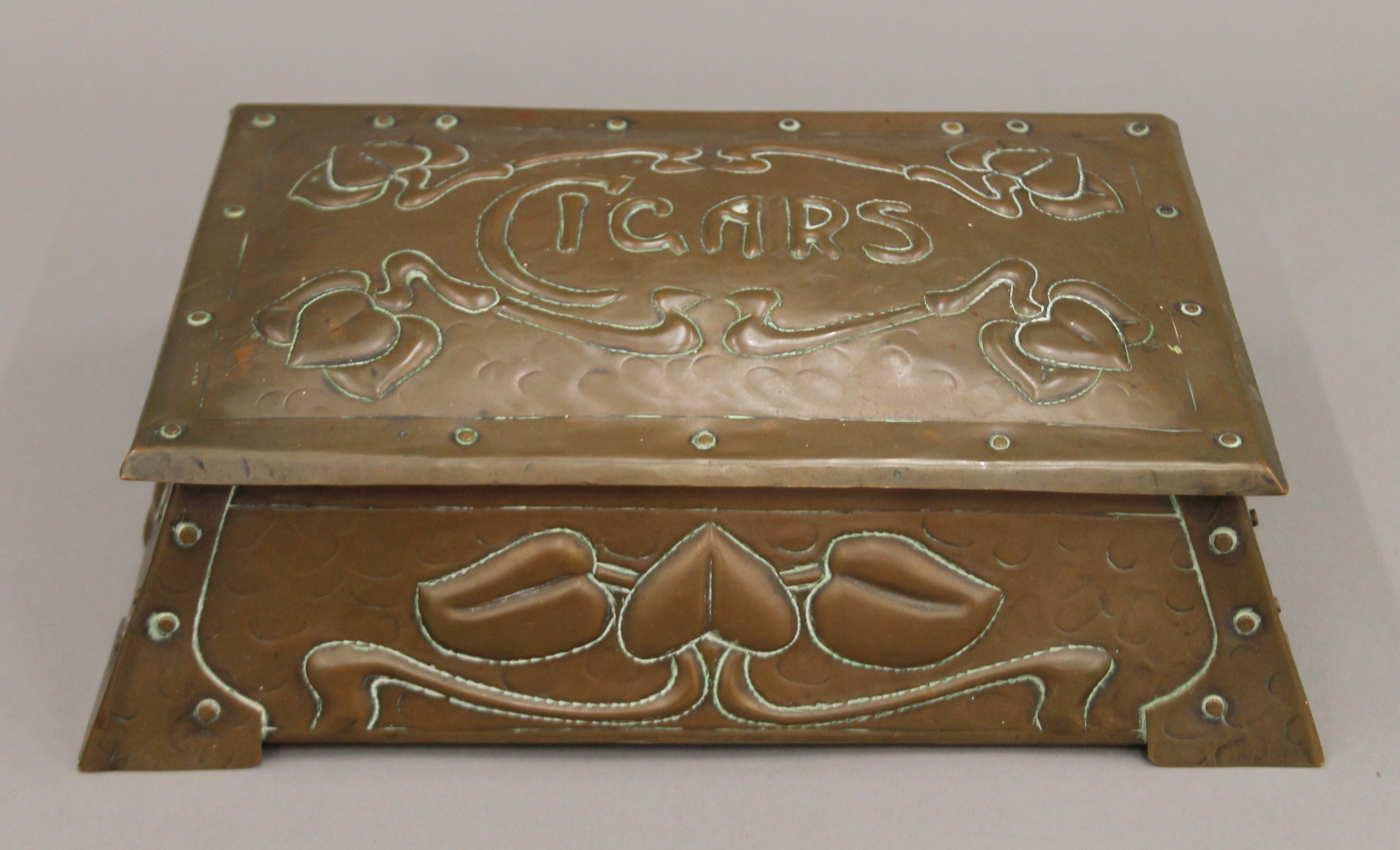 An Arts and Crafts copper cigar box. 29 cm wide.