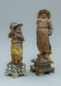 Two Oriental soapstone figures of warriors. The largest 30 cm high.