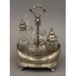 A Victorian silver cruet stand containing some original bottles. 26.5 cm high.