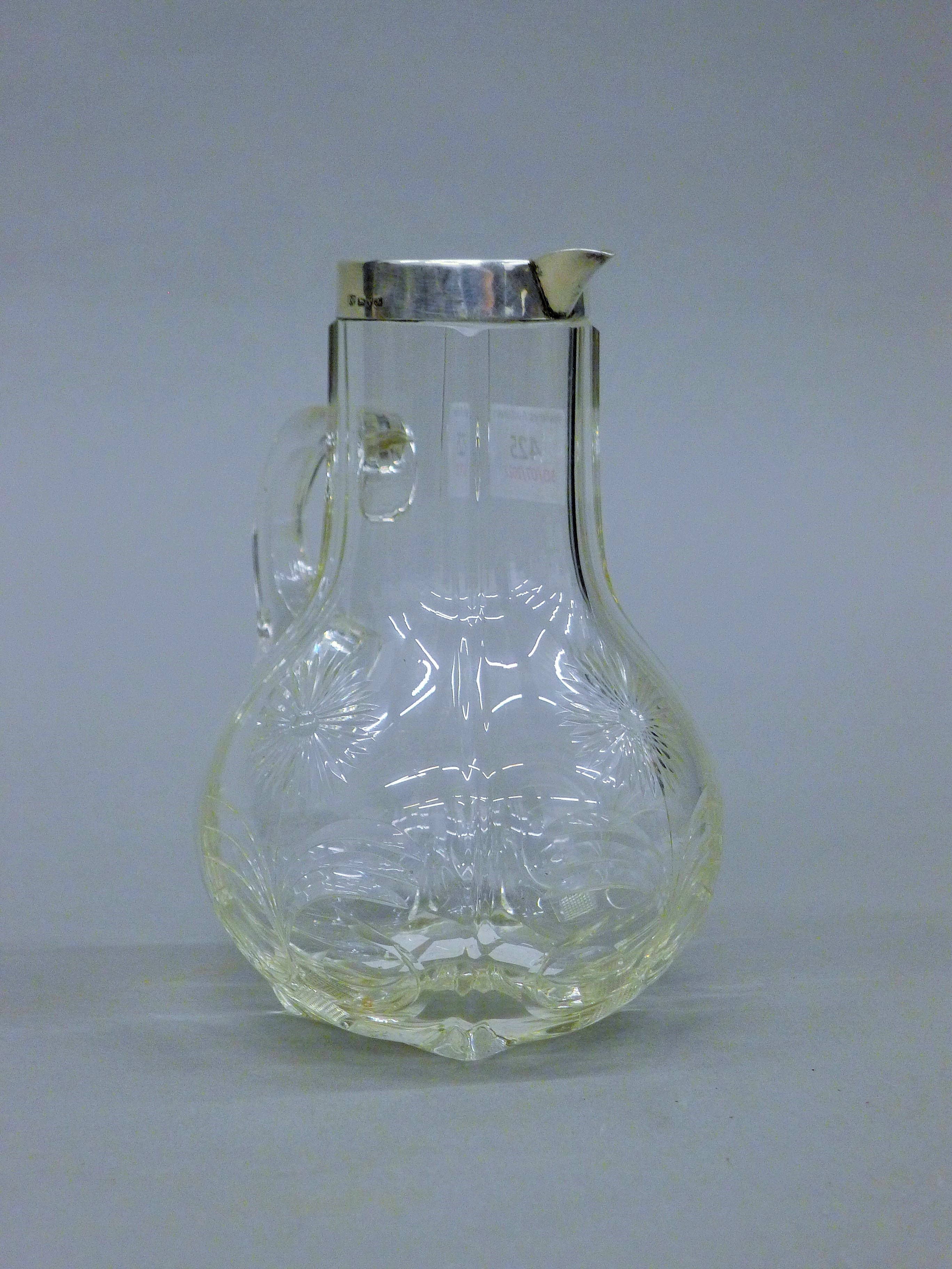 A silver rimmed and glass claret jug, hallmarked for Chester 1901 by Robert Pringle and Son. - Image 2 of 4