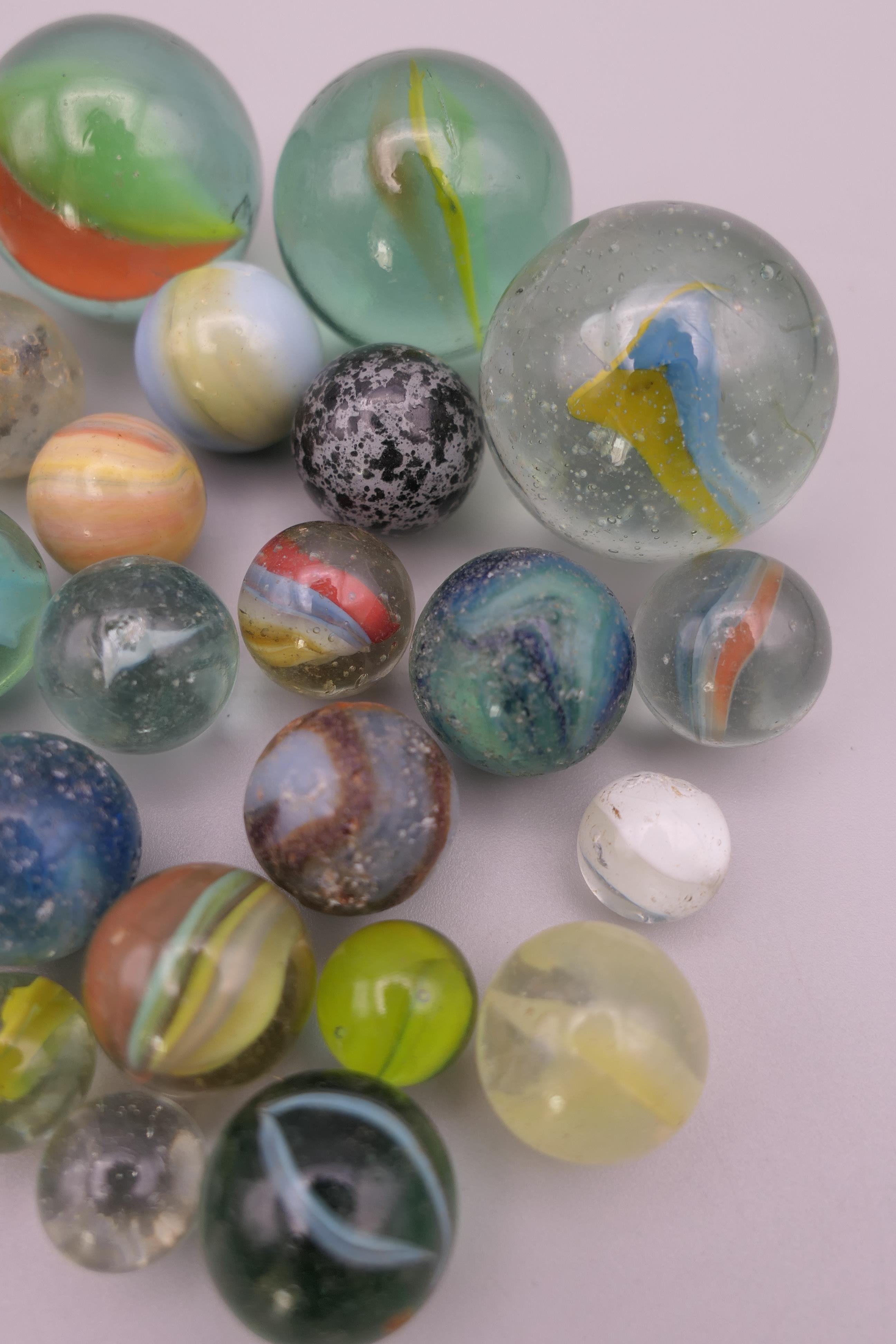 Four antique glass marbles (three approximately 1 inch diameter and the other 15/16th of an inch - Image 5 of 14