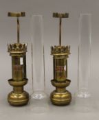 A pair of brass railway coach lamps, each with copper plaque inscribed VDP. Each 42 cm high overall.