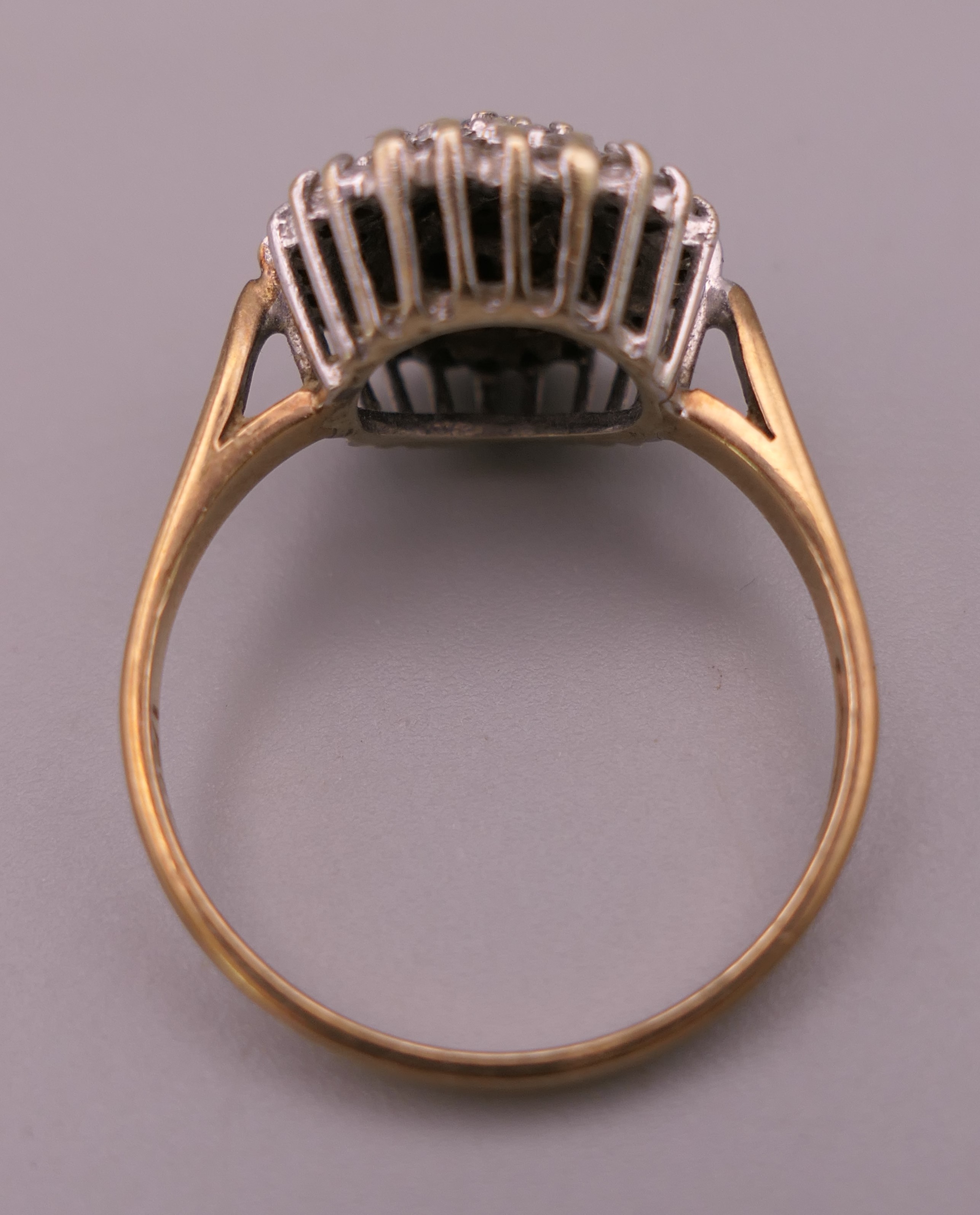 A 9 ct gold 0.5 carat diamond cluster ring. Ring size S/T. 4 grammes total weight. - Image 3 of 6