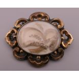 A Victorian unmarked gold mourning brooch. 5 cm wide. 11.1 grammes total weight.