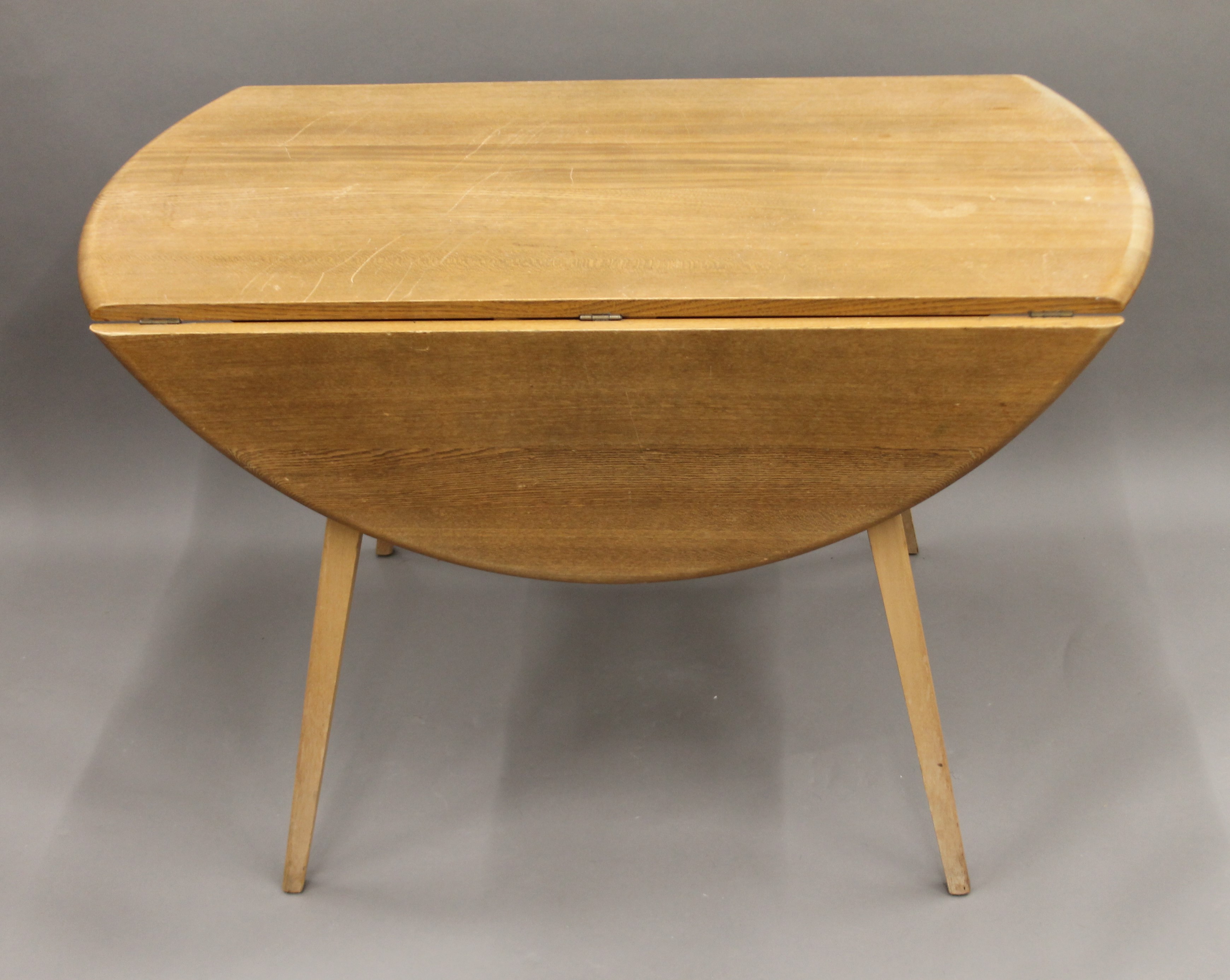 A blonde Ercol drop leaf table and two chairs. The table 112 cm long. - Image 2 of 8