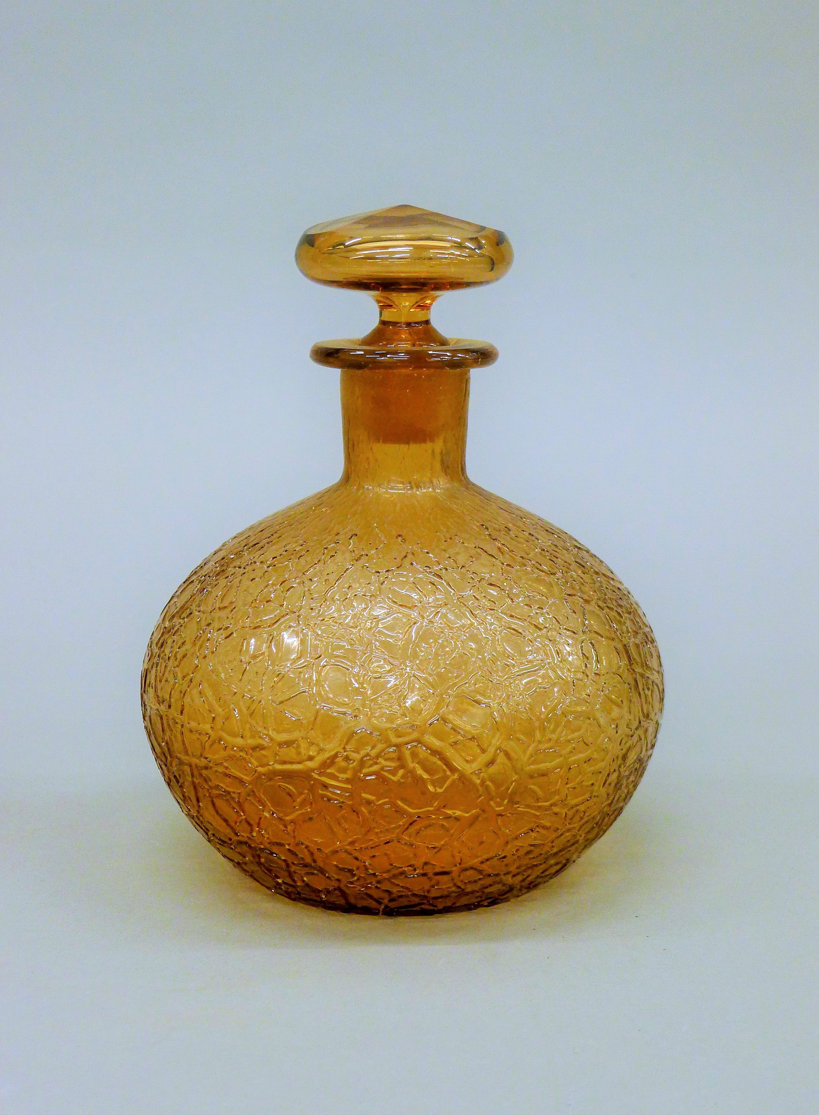 A Whitefriars amber glass decanter. 17 cm high.